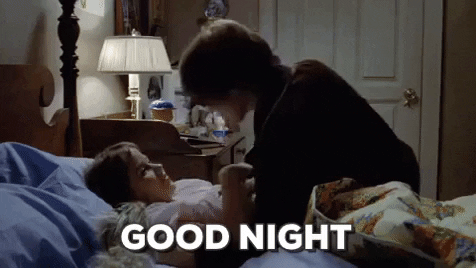 Movie gif. Ellen Burstyn as Chris in The Exorcist gives Linda McNeil as Regan a kiss as she lies in bed. Text, "Good night."