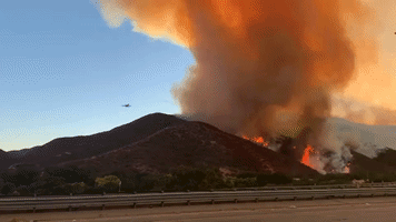 Aerial Firefighting Craft Drops Flame Retardant on Route Fire Near Castaic