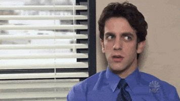 The Office gif. BJ Novak as Ryan sits next to a window, processing and breathing deeply, while his eyes scan around and meet our gaze.