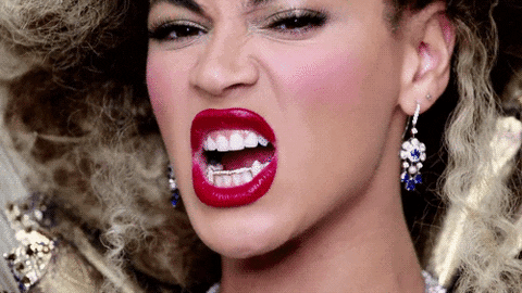 vampire teeth bow down GIF