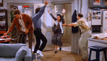 Seinfeld gif. With their feet dancing and arms thrown in the air, Jerry, Elaine, and George cheer in celebration while Kramer smiles.