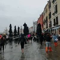 Heavy Downpour Causes Streets to Flood During Venice Marathon