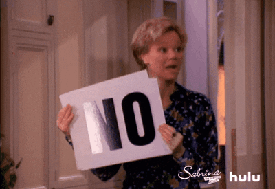TV gif. Caroline Rhea as Hilda Spellman on Sabrina the Teenage Witch looks at someone off screen with several signs reading "no" in her hand. Every time she says, “No,” she drops one of the signs in her hands that says the same thing in big bold letters. She looks at them like they're ridiculous for not understanding her firm answer of no.