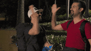 cbs happy high five the amazing race GIF