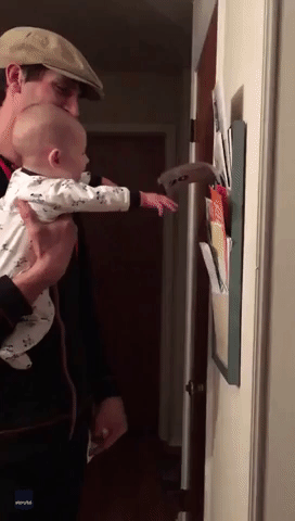 Baby Can't Control Laughter as Dad Flicks Paper