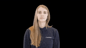 Video gif. A woman calmly reaches out in front of her to mime tapping or clicking on something. 