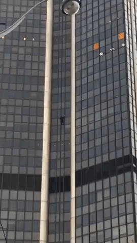 Person Scales Tallest Building in Paris