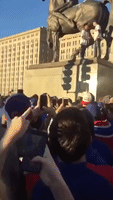 Chicago Cubs Fan Performs Trust Fall From Statue Into Arms of Waiting Fans Below