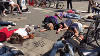 Extinction Rebellion Protesters Stage 'Die-In' in Cologne