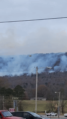 Helicopter Assists Firefighters Battling Blaze on Tennessee Mountain