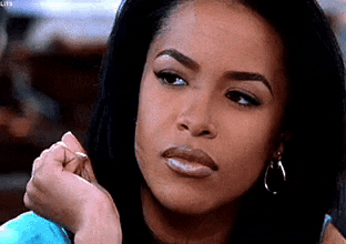 Movie gif. Aaliyah as Trish O'Day from Romeo Must Die wearily rolls her eyes and looks away, as if she's done talking about it.