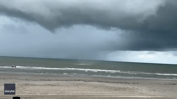 Waterspout Knocks Over Child, Whips Up Debris on Texas Beach