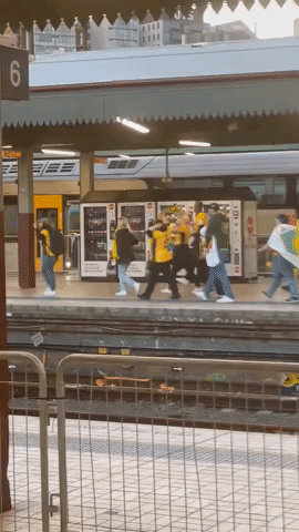 Matildas Supporters Cheer on Team at Sydney Railway Station