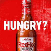 Sponsored gif. Chicken wings appear behind a bottle of Frank’s RedHot sauce. Text reads, “Hungry?”