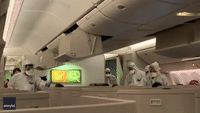 Authorities in Hazmat Suits Check Passengers From Hong Kong for Coronavirus at Milan Airport