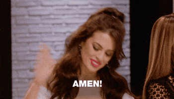 TV gif. A woman from ANTM with long brown hair slaps the table with a smile. Text, Amen!