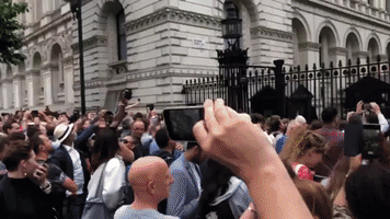 Boos, Music Plays Outside Following Johnson Resign