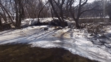 Ice Chunks and a Stranded Vehicle Left by Severe Flooding in Sioux Falls