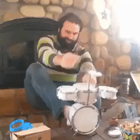 Musician Unleashes Epic Performance on Tiny Drum Set