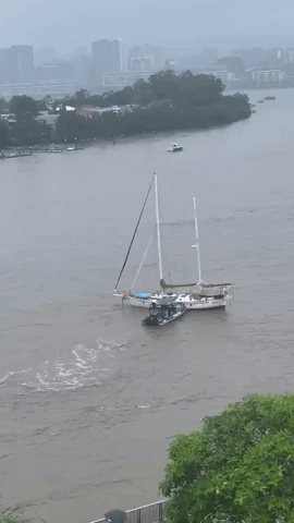 Boats Drift Down Swollen Brisbane River Amid Deadly Flooding in Queensland