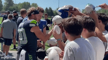 kingkaps7 giphyupload kingkaps7 cooper kupp sam darnold signing following the 15th practice of their first seahawks training camp GIF