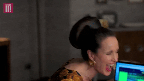 TV gif. Andie MacDowell as Ivy in Cuckoo laughs hysterically as she leans back with her eyes closed and mouth gaping open. 