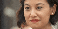 Reality TV gif. Stephanie Chen in The Great American Baking Show cracks a wide smile.