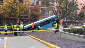Steam Billows From Pittsburgh Sinkhole as Swallowed Bus Remains Stuck