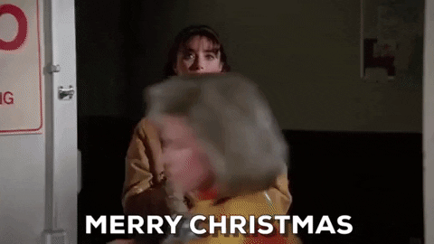 Movies gif. Karen Allen as Claire in Scrooged. She stares at someone as a door slowly closes and says, "Merry Christmas."