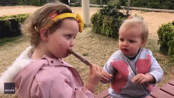 Toddlers Share Ice Cream 