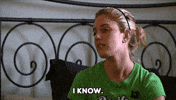 Reality TV gif. Heidi Montag in The Hills, seated on a bed, looks down at her lap as she says, "I know," which appears as text. 
