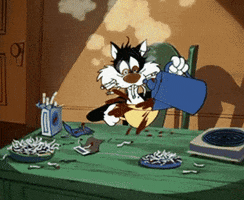 Cartoon gif. Sylvester from Looney Tunes shakes and trembles, buzzed our and spilling coffee while trying to pour it into his cup, with a mouthful of cigarettes at a table littered with cigarettes.