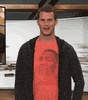 TV gif. Daniel Tosh on Tosh.0 smiles at us with an exaggerated wink.