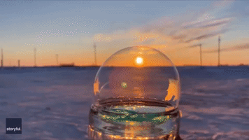 Ice Crystals Form on Bubbles as Sun Sets in West Minnesota