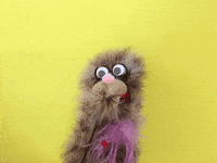 Video gif. Carl puppet blows a big kiss.