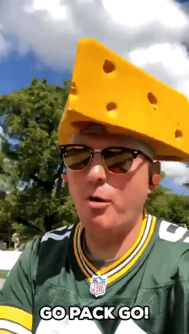 Packers Fan Mows Lawn in Cheesehead Hat 