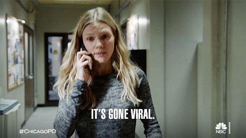 TV gif. In a scene from Chicago PD, a young woman walks along a hallway while on a phone call. Text, It's gone viral.