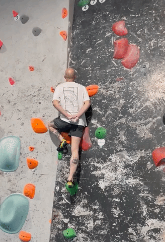 Climber Scales Wall With Hands Behind His Back