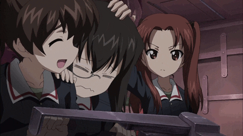 Cartoon gif. An anime scene of a troubled girl with black hair and a monocle, being consoled by girls on either side of her. The girl with dark brown hair on the left speaks cheerfully with eyes closed, while the girl with light brown pigtails on the right stoically rubs the troubled girl's head.