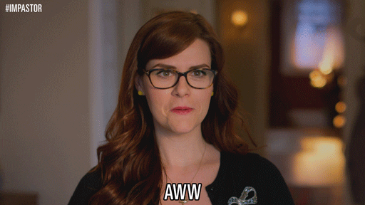 TV gif. Sara Rue as Dora Winston from Impastor tilts her head shyly and smiles while saying “Aww.”