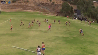 Aussie Rules Player Rescues Tiny Pitch Invader During Match