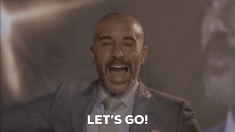 Sports gif. Jon Anik, a commentator for UFC, points at us and yells energetically, "Let's go!"
