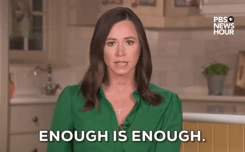 Video gif. Republican Alabama Senator Katie Britt delivers the 2024 Republican response to President Biden's State of the Union address. She intensely looks at the camera with wide eyes and an angry expression as she says "Enough is enough" putting emphasis on each word in her sentence. 