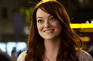 Celebrity gif. Emma Stone gives us a double thumbs up while scrunching her nose and shoulders cutely. She bites one lip and turns the thumbs to point at herself before pointing them away, indicating that she has to go.