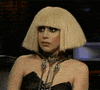 Celebrity gif. Lady Gaga quirks the side of her mouth, conveying discomfort.