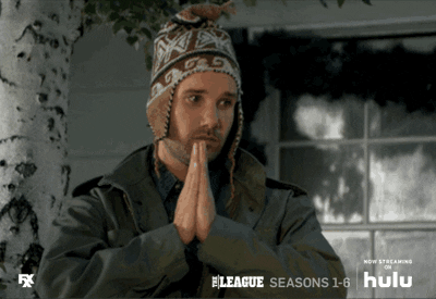 TV gif. With hands pressed together to pray, John Lajoie as Taco in The League exhales uneasily and raises his eyes up.