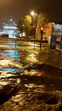 Floodwater Surges Down Lisbon Street Following Heavy Rain