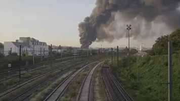 Smoke Rises From Warehouse Fire Near Paris Commuter Line