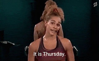 Ad gif. An instructor for Peloton is sweating and walking briskly as she informs is, "It is Thursday."