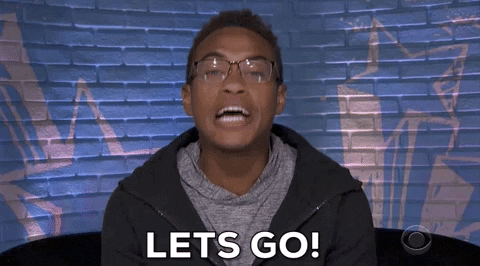 Reality TV gif. Sitting in front of a blue brick wall painted with stars, David on Big Brother says urgently, “Let’s go!”